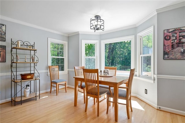 4423 Windsor Oaks Cir, Marietta, GA 30066 - dining room with light wood-style flooring, a chandelier, baseboards, and ornamental molding