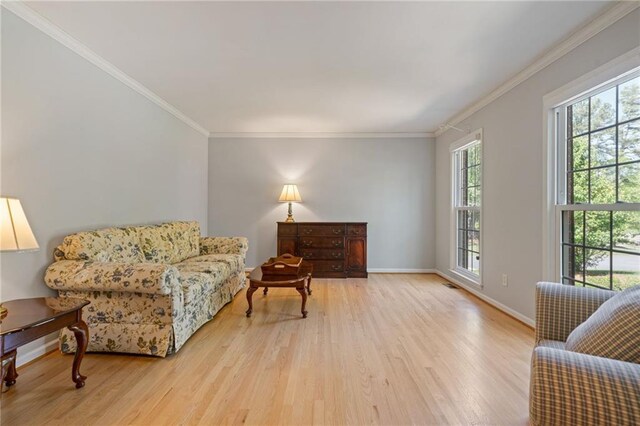 4423 Windsor Oaks Cir, Marietta, GA 30066 - living area with wood finished floors, ornamental molding, and baseboards