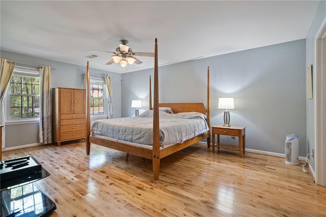 4423 Windsor Oaks Cir, Marietta, GA 30066 - bedroom with light wood finished floors, baseboards, and a ceiling fan