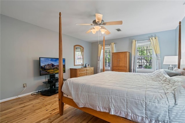 4423 Windsor Oaks Cir, Marietta, GA 30066 - bedroom with light wood-style floors, baseboards, and ceiling fan