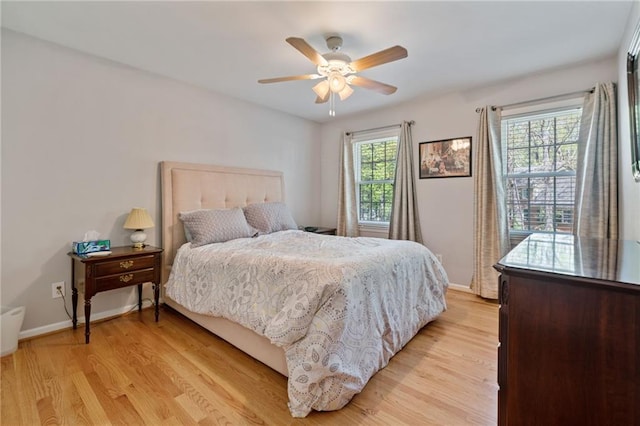 4423 Windsor Oaks Cir, Marietta, GA 30066 - bedroom featuring light wood-style floors, baseboards, and ceiling fan