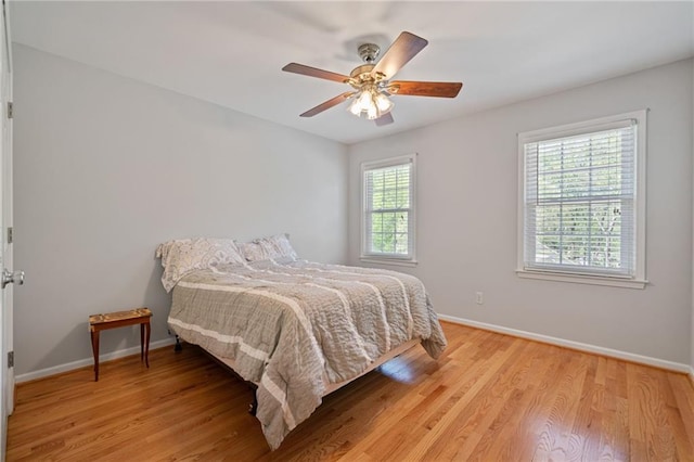 4423 Windsor Oaks Cir, Marietta, GA 30066 - bedroom featuring light wood-style flooring, baseboards, and ceiling fan