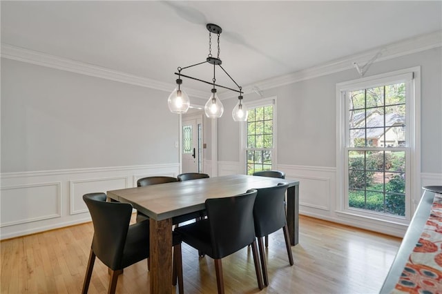4423 Windsor Oaks Cir, Marietta, GA 30066 - dining area featuring light wood-type flooring, crown molding, and wainscoting