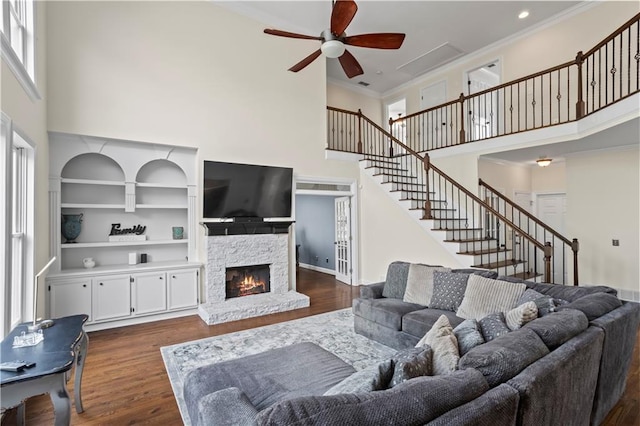 410 Hickory Fairway Ct, Woodstock, GA 30188 - living room featuring a high ceiling, ceiling fan, stairs, a fireplace, and dark wood finished floors