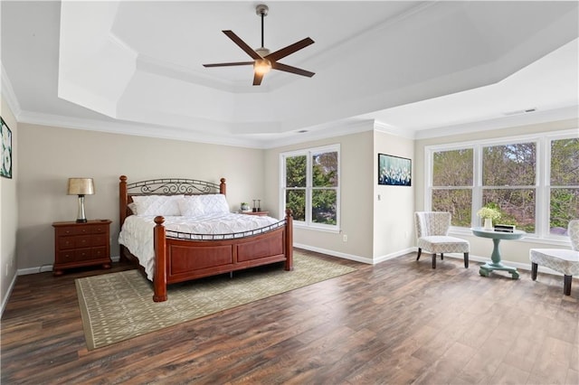 410 Hickory Fairway Ct, Woodstock, GA 30188 - bedroom featuring a tray ceiling, dark wood-style flooring, ornamental molding, baseboards, and a ceiling fan