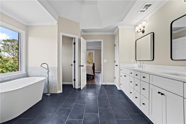410 Hickory Fairway Ct, Woodstock, GA 30188 - ensuite bathroom with double vanity, a freestanding bath, tile patterned floors, crown molding, and baseboards