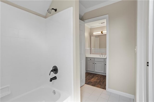 410 Hickory Fairway Ct, Woodstock, GA 30188 - full bathroom featuring ornamental molding, vanity, shower / bath combination, tile patterned flooring, and baseboards