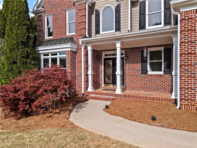410 Hickory Fairway Ct, Woodstock, GA 30188 - doorway to property with brick siding and covered porch