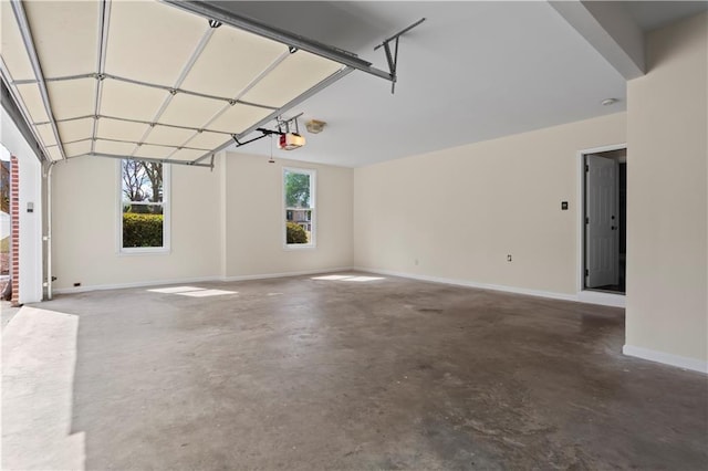 410 Hickory Fairway Ct, Woodstock, GA 30188 - garage with a garage door opener and baseboards