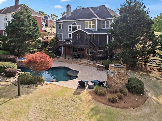 410 Hickory Fairway Ct, Woodstock, GA 30188 - rear view of house with stairway, a sunroom, a patio area, and an outdoor pool