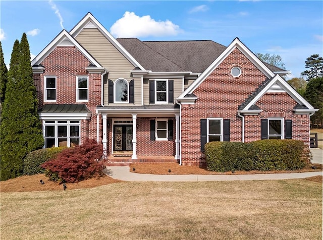 410 Hickory Fairway Ct, Woodstock, GA 30188 - traditional-style house featuring a front yard, brick siding, and a porch