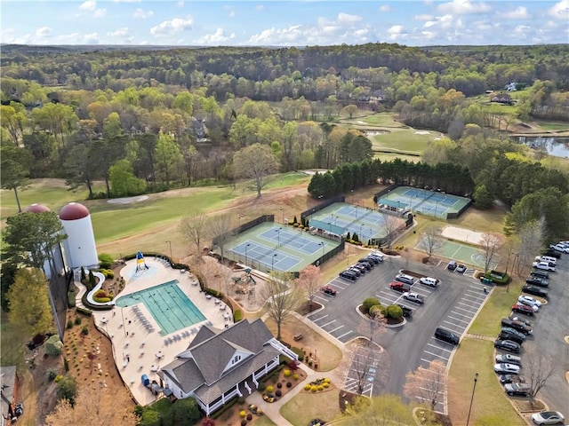 410 Hickory Fairway Ct, Woodstock, GA 30188 - aerial overview of property's location featuring a local golf course, a pool area, and a heavily wooded area