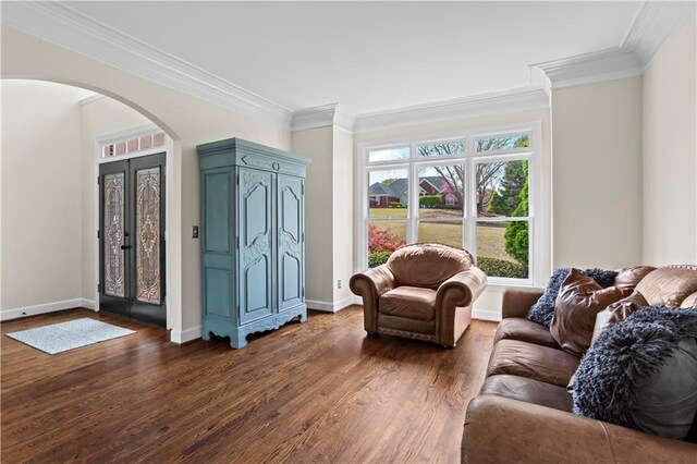 410 Hickory Fairway Ct, Woodstock, GA 30188 - living room with arched walkways, crown molding, dark wood-type flooring, and baseboards