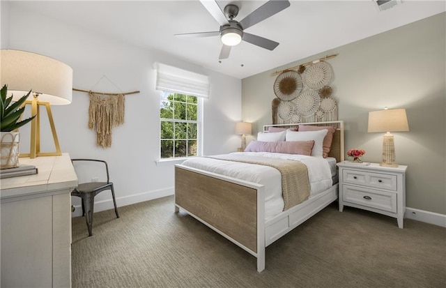 bedroom featuring dark colored carpet, a ceiling fan, and baseboards