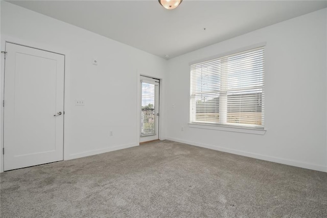 spare room with light colored carpet