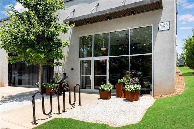 back of house featuring a lawn and a patio