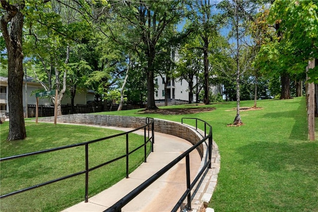 view of home's community featuring a lawn