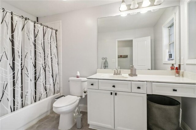 full bathroom with toilet, vanity, and shower / bath combination with curtain