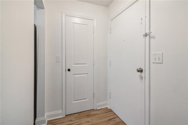 doorway to outside featuring light wood-type flooring