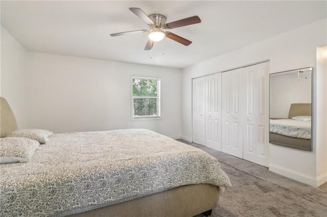 carpeted bedroom featuring a closet and ceiling fan