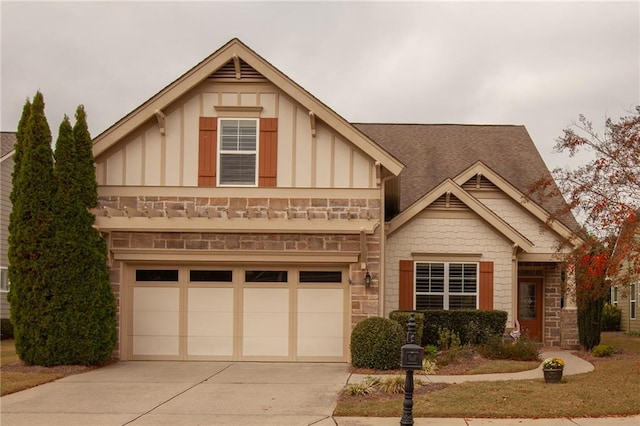 view of front facade with board and batten siding, concrete driveway, an attached garage, and stone siding