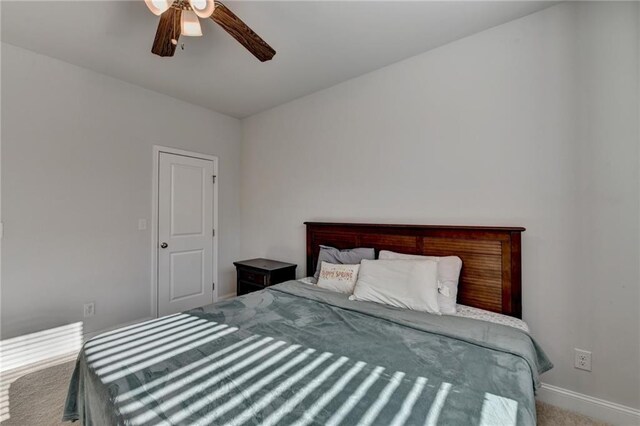 bedroom with baseboards, carpet, and ceiling fan