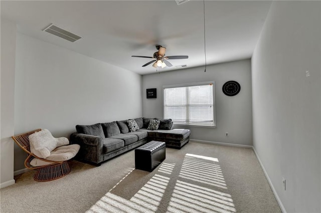 carpeted living room with a ceiling fan, baseboards, and visible vents
