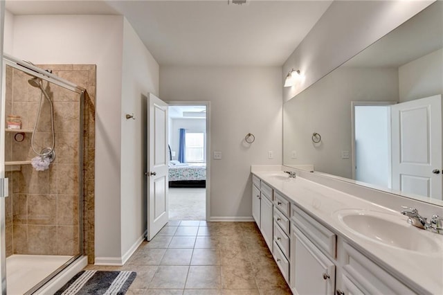 full bath featuring double vanity, a shower stall, and a sink