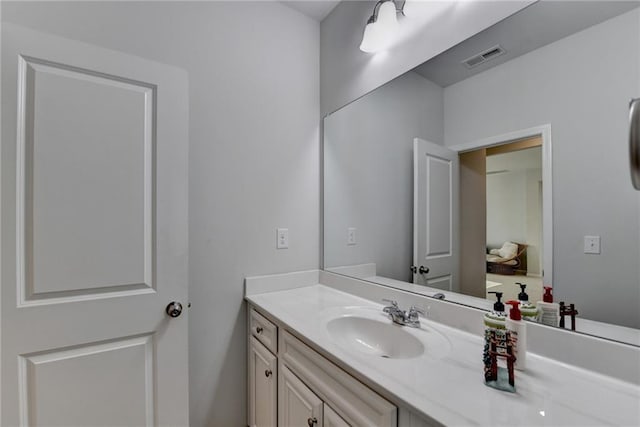 bathroom with visible vents and vanity