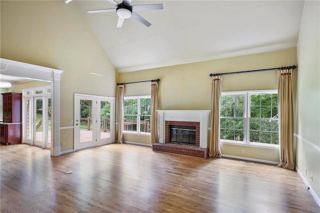 963 Bolingbrook Dr SW, Marietta, GA 30064 - unfurnished living room with plenty of natural light, high vaulted ceiling, a ceiling fan, wood finished floors, and baseboards