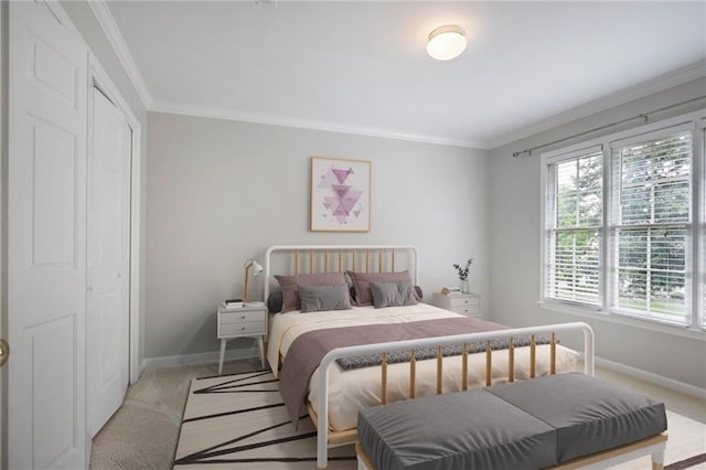 963 Bolingbrook Dr SW, Marietta, GA 30064 - bedroom featuring baseboards, ornamental molding, light colored carpet, and a closet