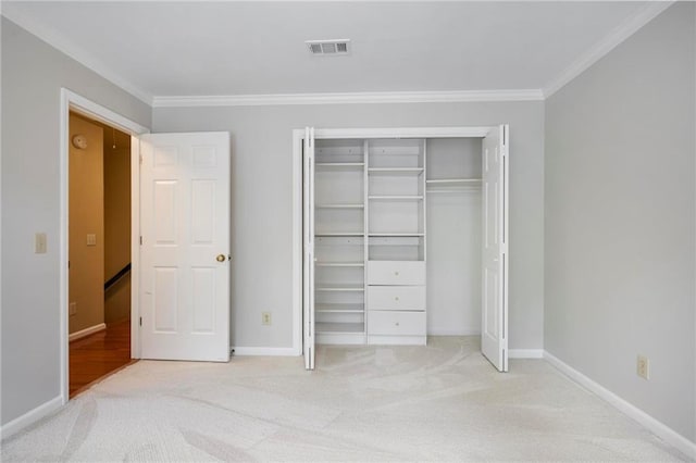963 Bolingbrook Dr SW, Marietta, GA 30064 - unfurnished bedroom with ornamental molding, carpet, baseboards, and a closet