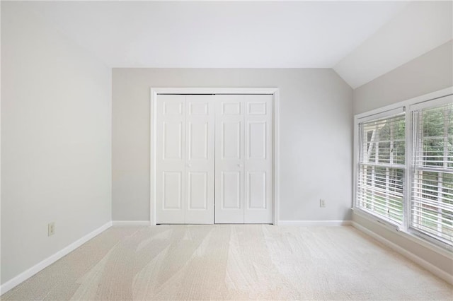 963 Bolingbrook Dr SW, Marietta, GA 30064 - unfurnished bedroom featuring carpet flooring, baseboards, multiple windows, and vaulted ceiling