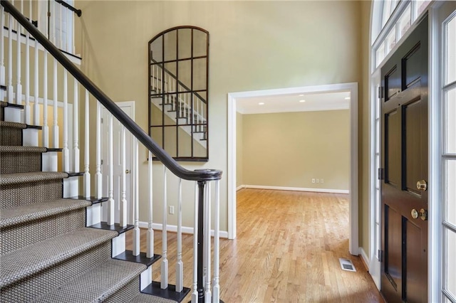 963 Bolingbrook Dr SW, Marietta, GA 30064 - entryway featuring a high ceiling, wood finished floors, stairs, and baseboards