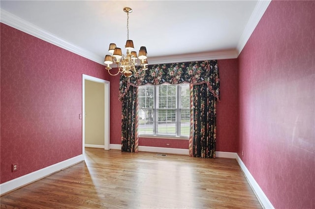 963 Bolingbrook Dr SW, Marietta, GA 30064 - empty room with a chandelier, wood finished floors, crown molding, and baseboards
