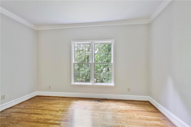 963 Bolingbrook Dr SW, Marietta, GA 30064 - spare room with crown molding, wood finished floors, and baseboards