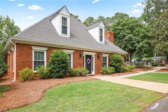 963 Bolingbrook Dr SW, Marietta, GA 30064 - cape cod-style house featuring a shingled roof, brick siding, and a chimney