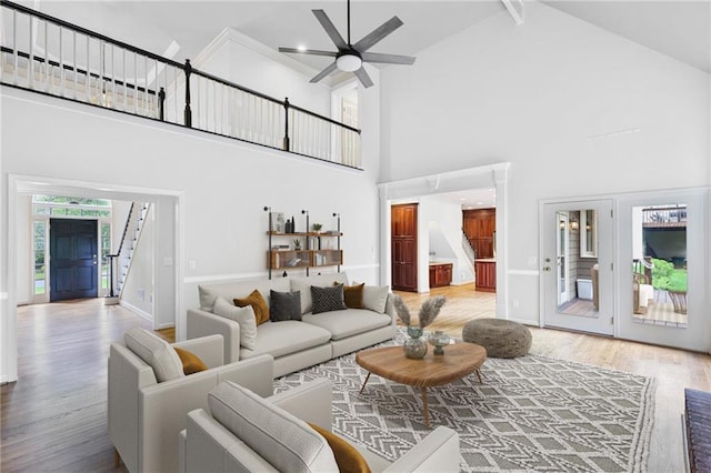 963 Bolingbrook Dr SW, Marietta, GA 30064 - living room with stairs, high vaulted ceiling, wood finished floors, ceiling fan, and baseboards