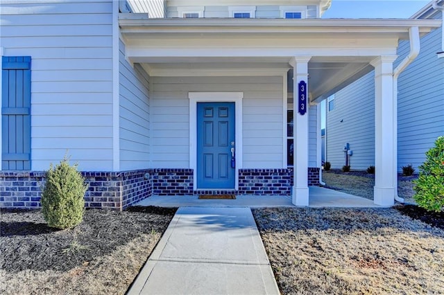 entrance to property with a porch