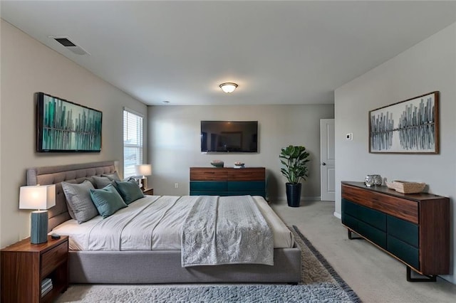 bedroom featuring light carpet