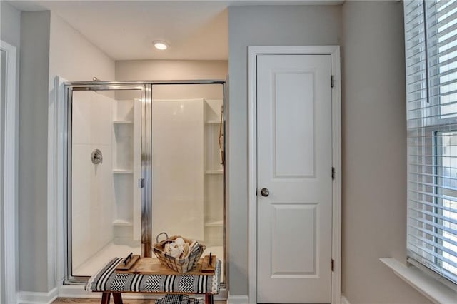 bathroom with a shower with shower door