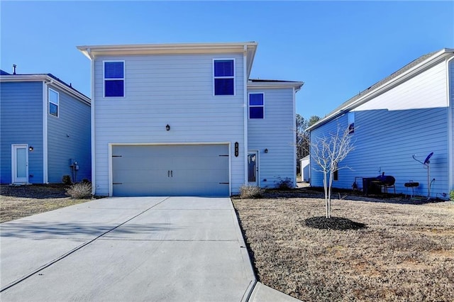 rear view of property with a garage