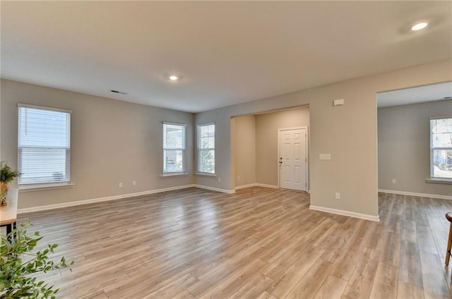 unfurnished living room featuring light wood-type flooring