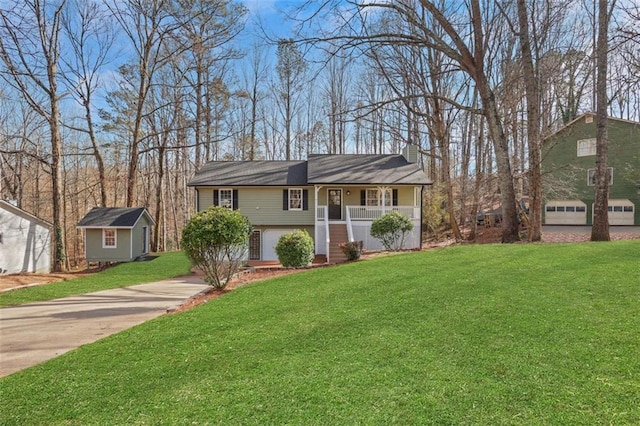 view of front of house with covered porch, an outdoor structure, concrete driveway, a front lawn, and a chimney