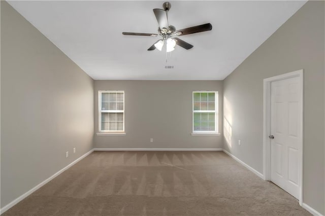 1011 Riverclift Dr, Covington, GA 30016 - unfurnished room featuring ceiling fan, carpet floors, baseboards, and vaulted ceiling