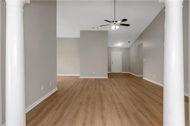1011 Riverclift Dr, Covington, GA 30016 - spare room with ornate columns, ceiling fan, baseboards, and lofted ceiling