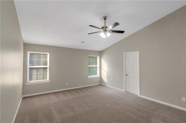 1011 Riverclift Dr, Covington, GA 30016 - unfurnished room with carpet flooring, ceiling fan, baseboards, and vaulted ceiling