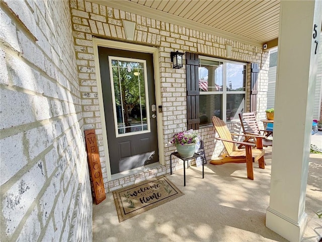 57 Matador, Newnan, GA 30263 - view of exterior entry featuring covered porch and brick siding