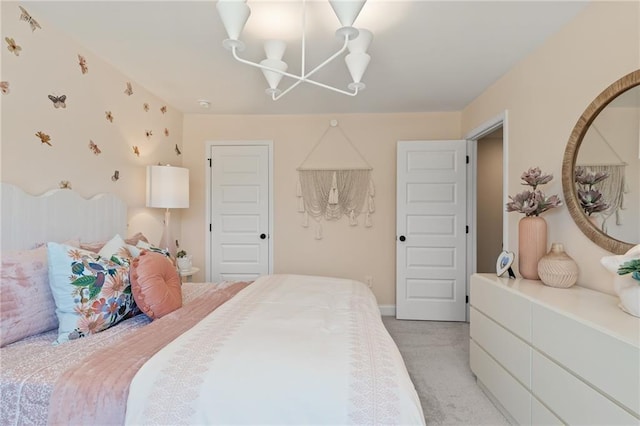 carpeted bedroom with an inviting chandelier