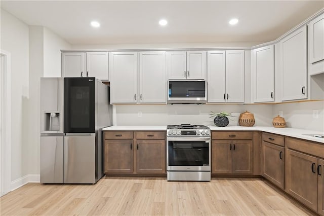 kitchen featuring appliances with stainless steel finishes and light wood-type flooring